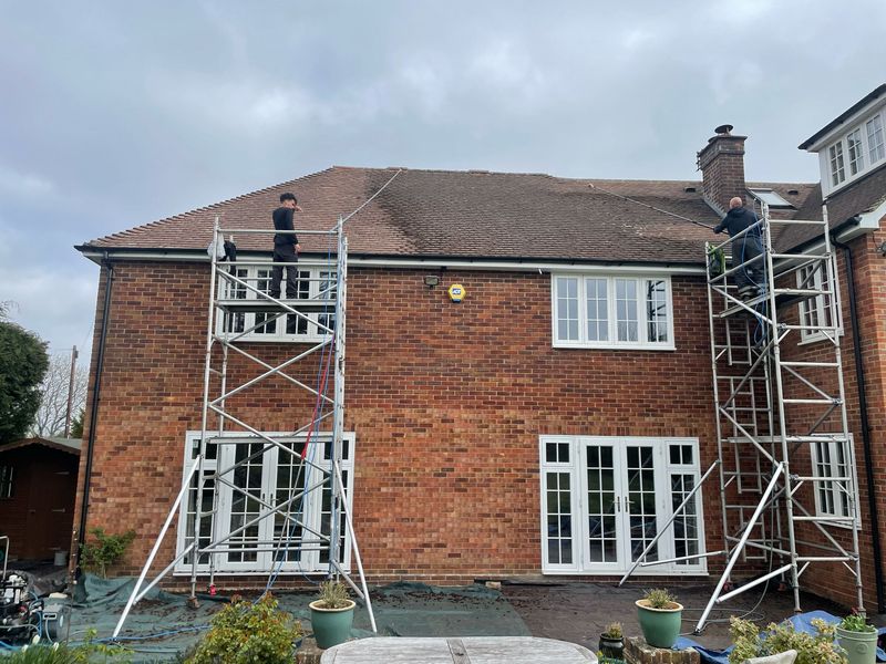 Roof cleaning carried out safely from scaffold towers by The Roof Moss Cleaners in Irthlingborough